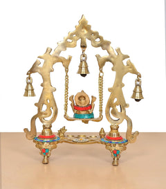 Brass Ganesha swing idol rear view with gold-tone back arch, bell holders, tripod base