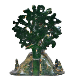 Brass Dakshinamurti Shiva statue back view, leafy circular motif with seated base