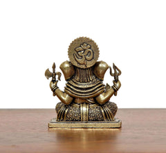 AONA Superfine Brass Lord Ganesha idol, back view with raised hands, seated on ornate base.