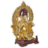 Brass Ganpati Bappa idol profile with gold ornaments, red cap, on red base