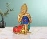 Brass sitting Buddha idol with blue mosaic robe and multicolor patterned base