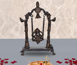 Brass Ganesha swing idol statue on ornate base with chained swing and arched frame