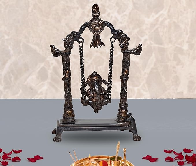 Brass Ganesha swing idol statue on ornate base with chained swing and arched frame