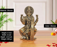 Bronze Lakshmi idol on lotus, 4 inch height, detailed jewelry and four arms