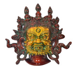 Mahakala protective mask wall hanging, gold face with fierce eyes and red accents