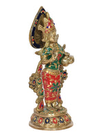Radha brass idol, rear angled view, blue cap, green ornaments, red skirt, gold base