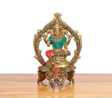 Front view Lakshmi brass idol with teal dress, red/green accents, multicolor jeweled halo