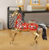 Brass running horse showpiece with red body, gold accents, and black mane