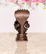 Copper Lakshmi Narasimha figurine, back view of hood and square base