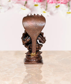 Copper Lakshmi Narasimha figurine, back view of hood and square base