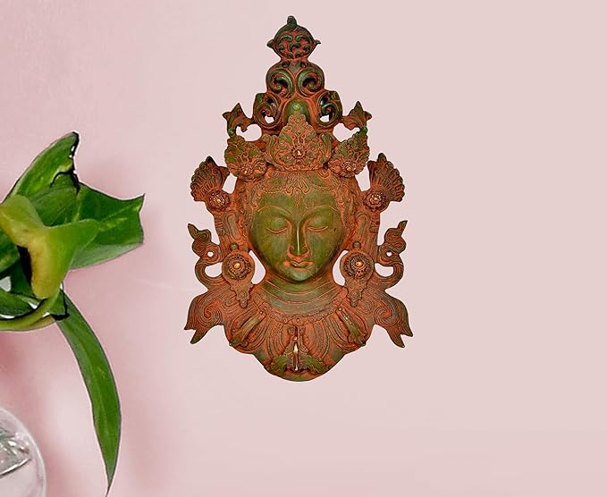 Tara mask statue wall hanging with ornate green face and bronze filigree details