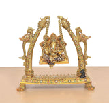 Front view brass Ganesha idol on swinging jhula with multicolor meenakari detailing
