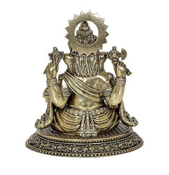Brass Ganesha idol statue, side view with decorated halo and patterned base