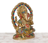 Brass Ganesha statue angled view, multicolor beads on arms and torso with halo
