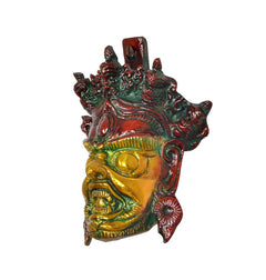 Mahakala/Nazar wall mask angled view, gold face with red-green accents, ornate brass