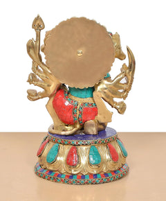 Brass Panchmukhi Hanuman idol, back view with round embossed disc and multicolor trim