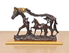 Horse and foal resin showpiece, two dark brown figures with golden mane, angled view.