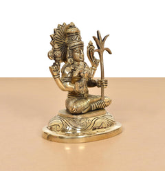 Golden Kamakshi Amman statue, seated with raised weapon-like hand and ornate belt