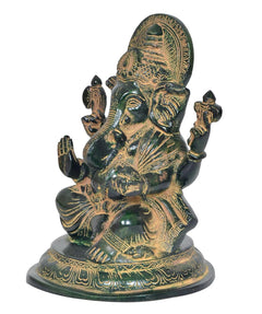 Lord Ganesha brass statue, side view, ornate crown and halo, seated with folded arm