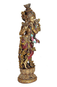 Resin Krishna playing-flute figure, side view, gold headpiece, multicolor garlands, round base