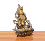 Brass Kuber Bhagwan murti, angled view showing seated posture and decorative pedestal