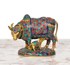 Kamdhenu cow statue with calf, front view, turquoise red and blue enamel pattern