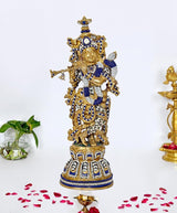 Brass Krishna idol playing flute, blue & white jeweled details, ornate crown