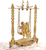 Brass Radha-Krishna swing idol, birds on top crossbar with hanging seat and base