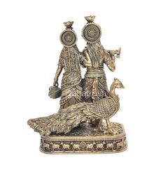 Brass Radha and Krishna statue idol rear angle, sculpted hair ornaments and flute hand