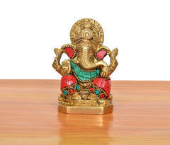 Brass Ganpati Bappa murti front view with red-and-green accents