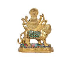 Brass Durga Maa statue on lion, close rear angle showing lion body and multicolour base