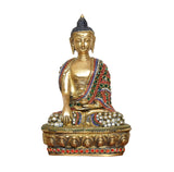 Front view of brass-toned meditating Buddha idol with jeweled robe and round gem accents