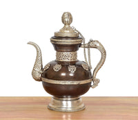 Brass teapot decorative spout and arched handle, engraved bands on dark brown body