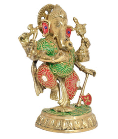 Brass dancing Ganesha figurine with blue eyes, red-and-green garments, round base