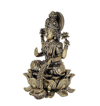 Brass Lakshmi statue idol side view, raised hand, seated on lotus