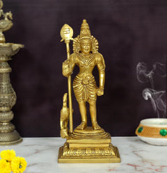 Golden brass Kartikeya statue with spear and helmeted head, standing on carved base