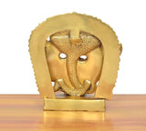 Brass Virat swaroop statue face detail, close-up of arched 15-face halo