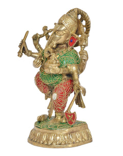 Brass dancing Ganesha statue, red-and-green patterned attire, raised arms and halo