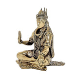 Brass Shiva idol seated on lotus mat, side view, raised hand and trident