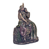 Angled view Radha-Krishna resin statue, layered robes in purple and green tones