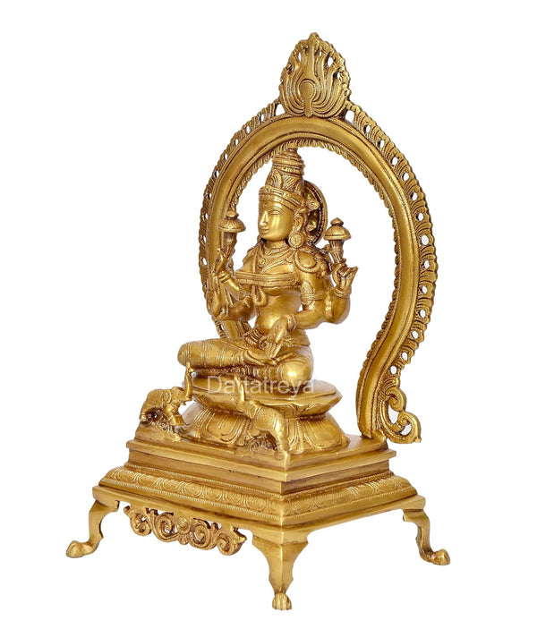 Brass Lakshmi Statue with Prabhavali - Hindu Goddess of Wealth and Prosperity - Intricate Brass Sculpture for Home Temple and Spiritual Decor (Height 13 Inch) Study Setting
