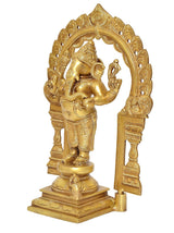 Side view of brass Ganesh standing statue with prabhavali arch and raised hand