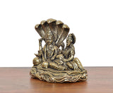 Brass Lakshmi with Lord Vishnu idol on Sheshnag, close-up angle