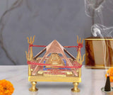 Brass Shri Yantra chowki: pyramid frame with red thread, gold feet, central golden shrine