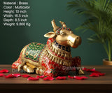 Brass Nandi statue seated, side view with jeweled multicolor painted details