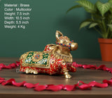 Brass seated Nandi statue with multicolor painted patterns and beaded collar