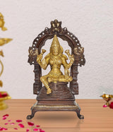 Brass Lakshmi idol statue, seated goddess with ornate arched backrest