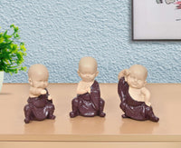 Little Kungfu Buddha monk sculpture, purple resin, hands folded in prayer, front view
