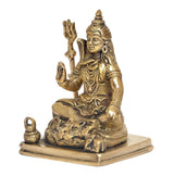 Brass Shiva deity sculpture seated with trident, side view, ornate base detailing
