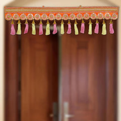 Diwali toran door hanging with circular patterns and multicolor tassels, orange border.